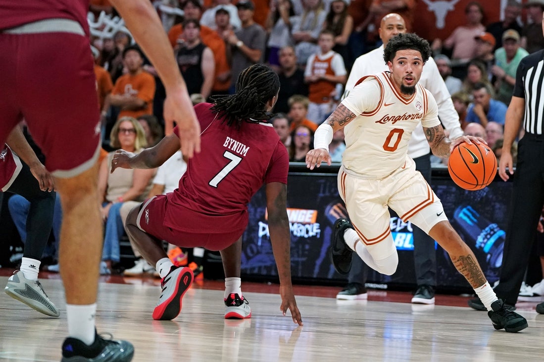Texas returns from busy stretch to take on Virginia