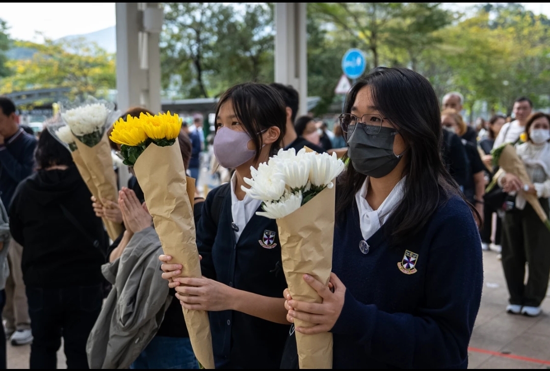 Hong Kong Fire Investigation Deepens as Public Grief Clashes with Government Crackdowns
