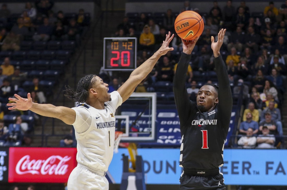 West Virginia survives late scare and holds off Cincinnati