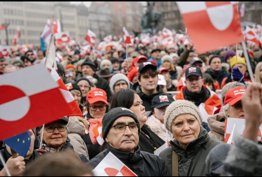 “Make America Go Away”: Satirical Red Caps Become Rallying Cry Against Trump’s Greenland Threat