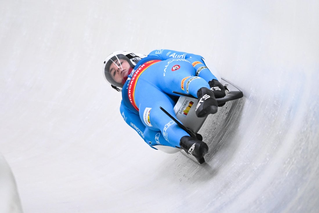 Italian men and women both win gold in luge doubles
