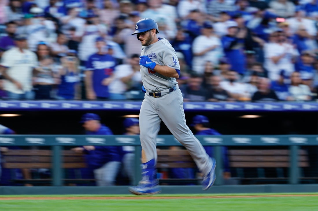 Dodgers belt 5 homers, escape Colorado with split