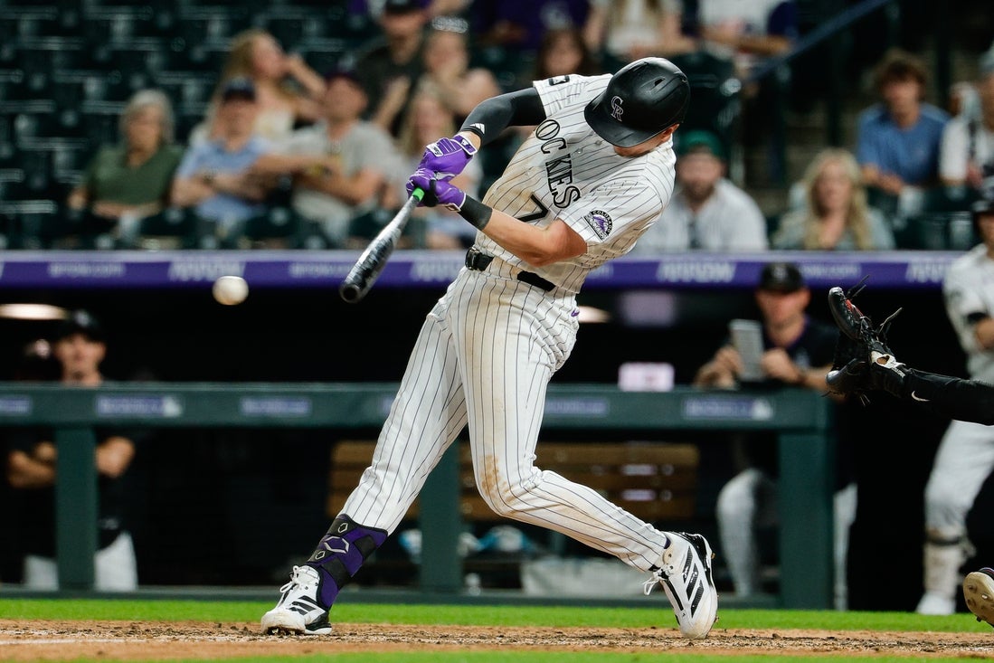 TJ Rumfield drives in four to lift Rockies past Reds