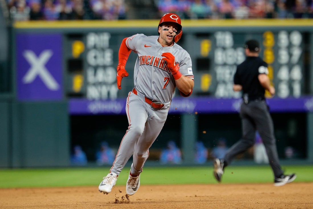 Reds hit four homers to power past Rockies